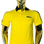 Mannequin wearing bright yellow short-sleeved polo shirt with Nikon logo on chest and black shoulder/collar accents; designed for chest 42–44 inches and neck 16–17 inches (size Large)