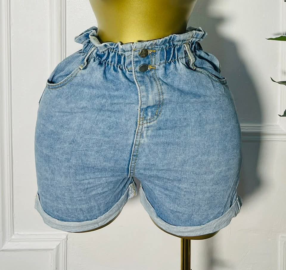 Front view of Sunflare™ light wash denim shorts with ruffle waistband and rolled hem, size 8 for 38–39 inch hips"