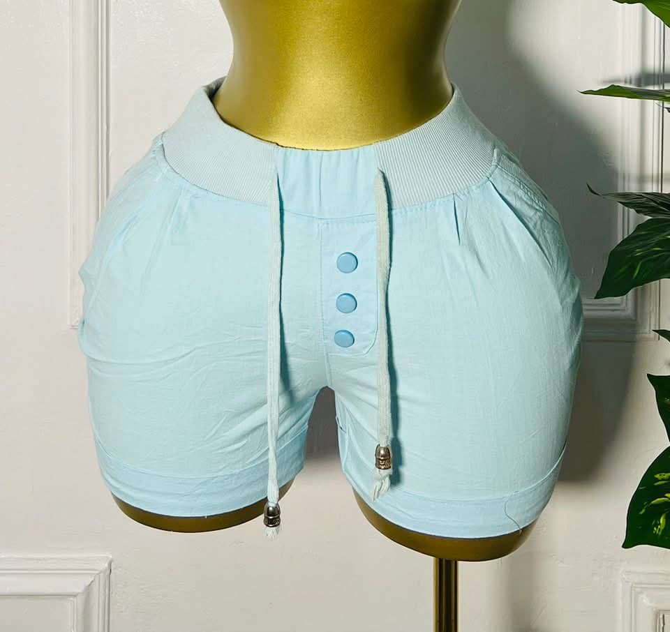 Front view of Front view of CloudEase™ light blue drawstring shorts with button accent and pockets, size 8–10"