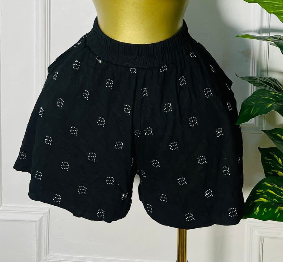 Front view of DotDrift™ black lounge shorts with white polka dot pattern and elastic waist, relaxed fit for sizes 40–42