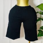 FlowFlex™ black knee-length lounge shorts with elastic waistband and minimalist cut, fits sizes small to large